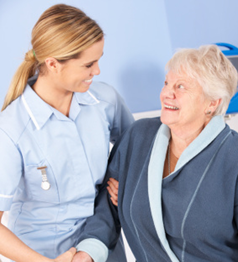 Healthcare worker supporting an older woman